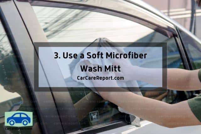 wiping car with microfiber mitt